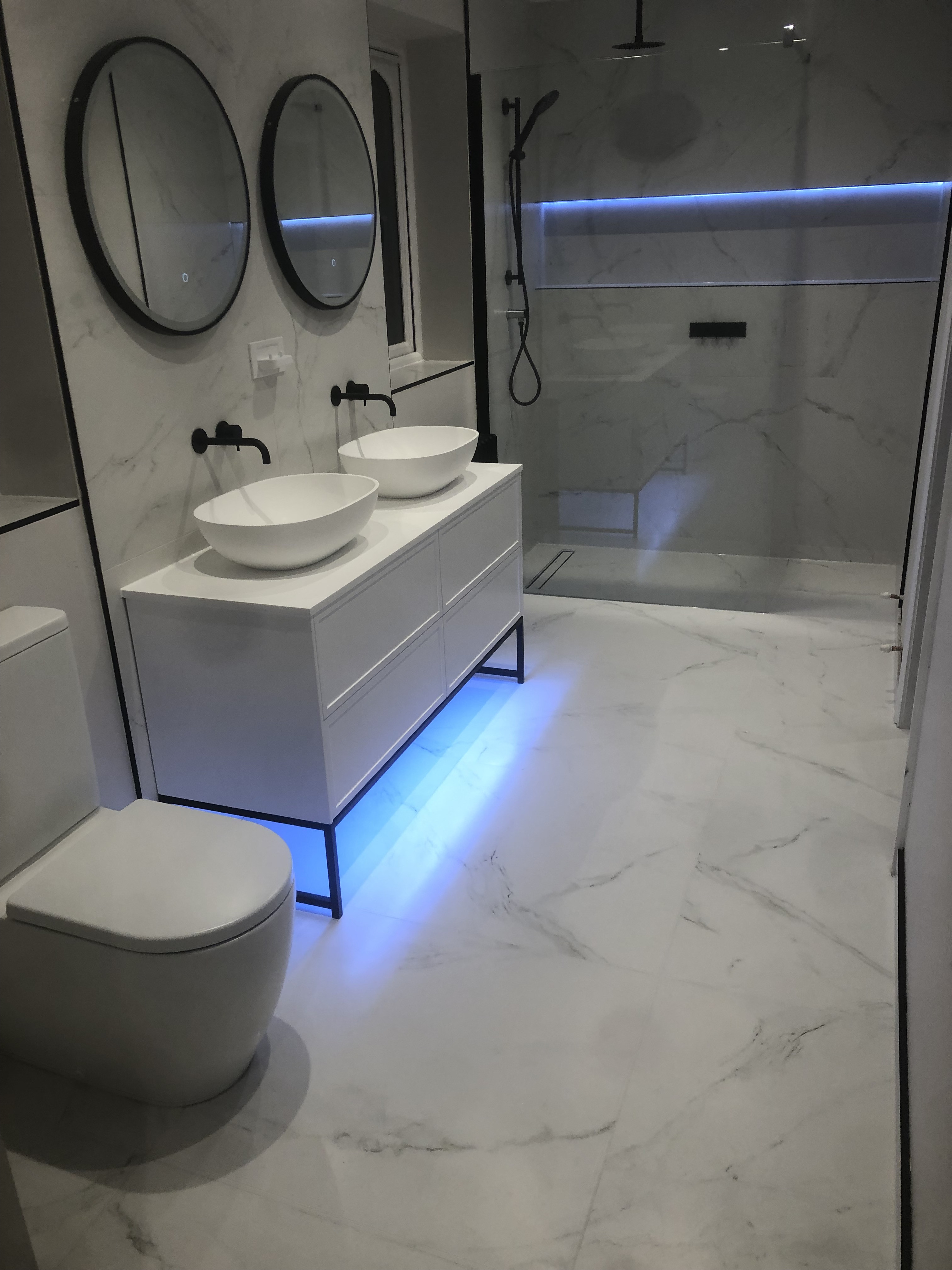 Modern bathroom with walk-in shower and double vanity